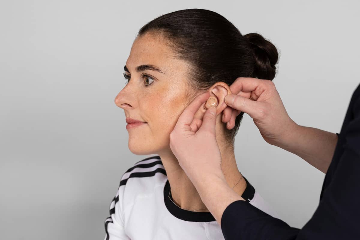 HomeSight clinician carrying out earwax removal by microsuction during a home visit